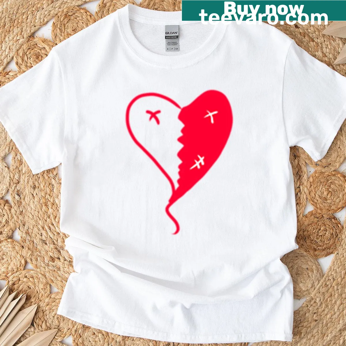 T-shirt with a graphic representing a broken heart and themes of resilience. — on a men's t-shirt