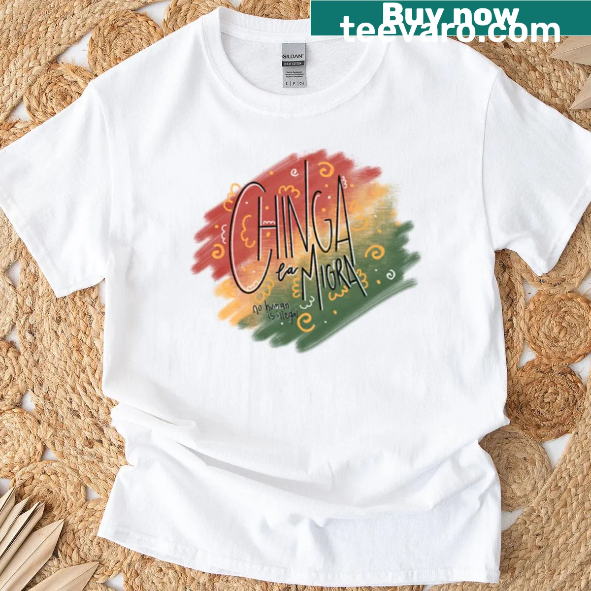 T-shirt displaying the phrase 'Chinga La Migra' in bold text — on a men's t-shirt