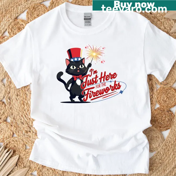 Whimsical T-shirt with a cartoon black cat and fireworks design
