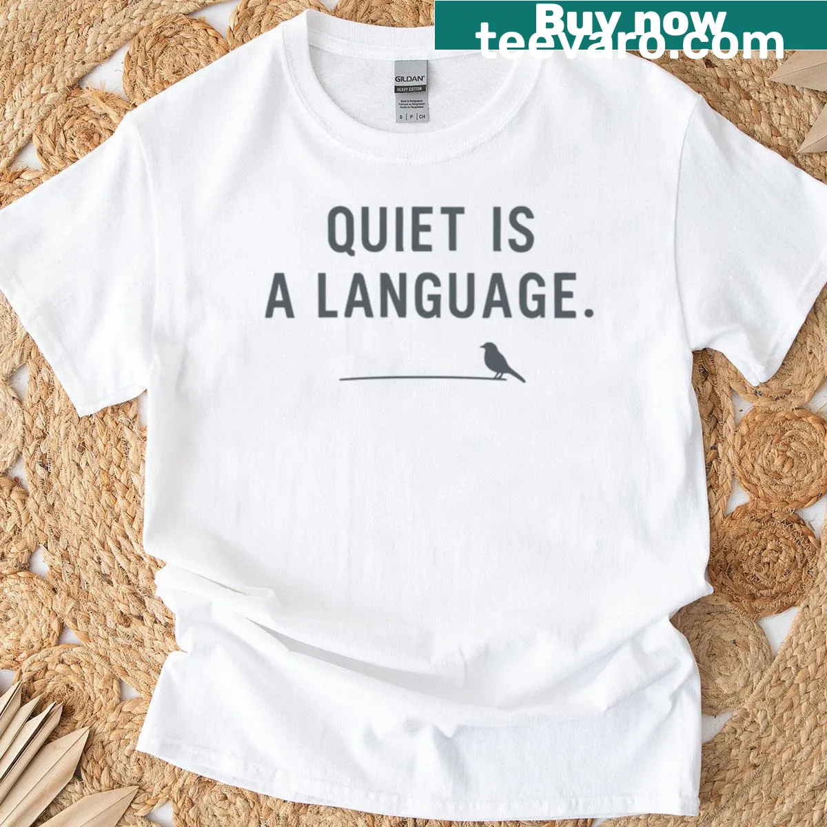 Minimalist T-shirt with the quote 'Quiet Is A Language' in clean typography — on a men's t-shirt