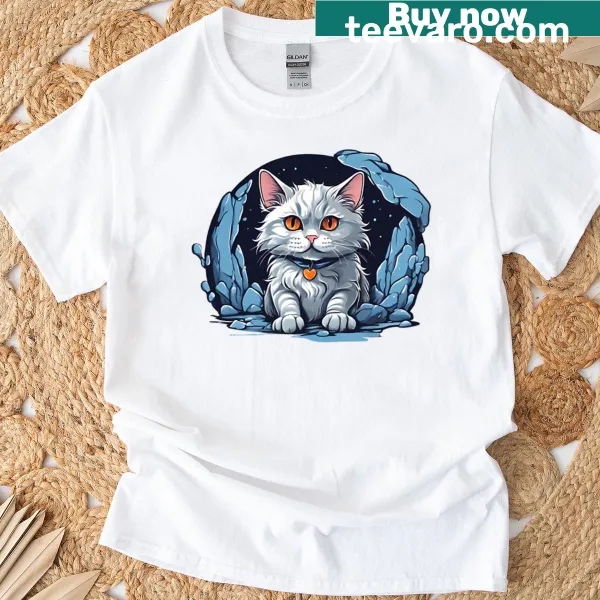 Whimsical cat illustration in a blue cave on a t-shirt