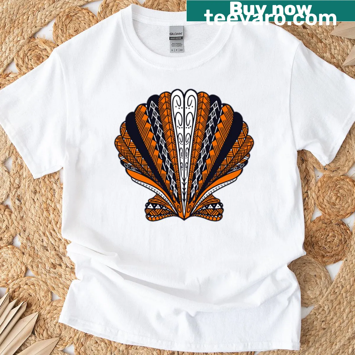 Vintage-distressed T-shirt with orange tribal clam shell graphic — on a men's t-shirt