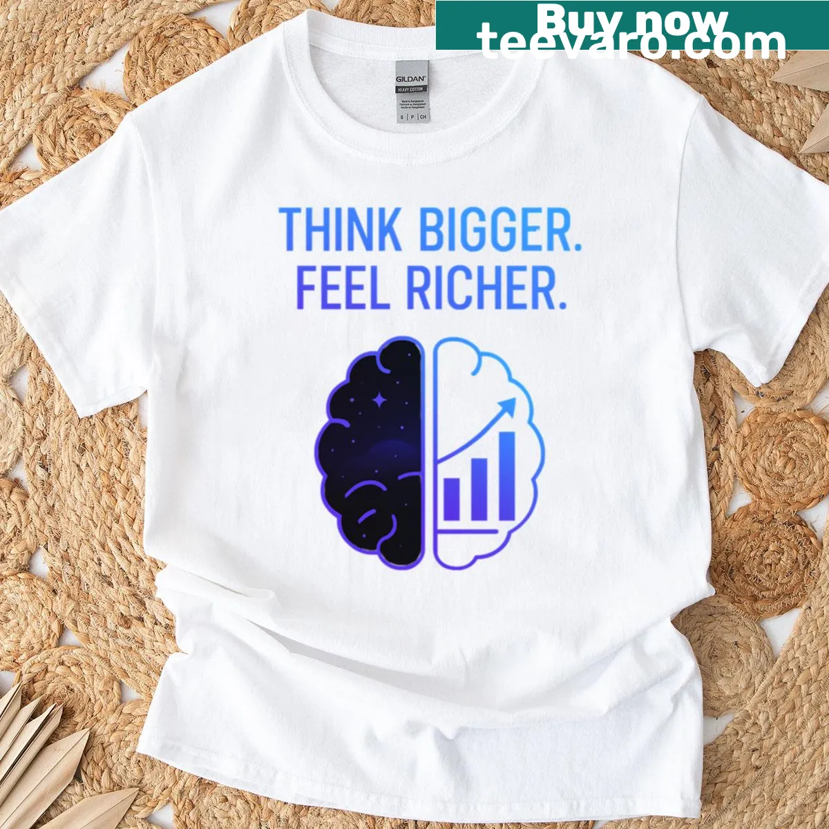 Minimalist T-shirt featuring the inspiring phrase 'Think Bigger Feel Richer' — on a men's t-shirt