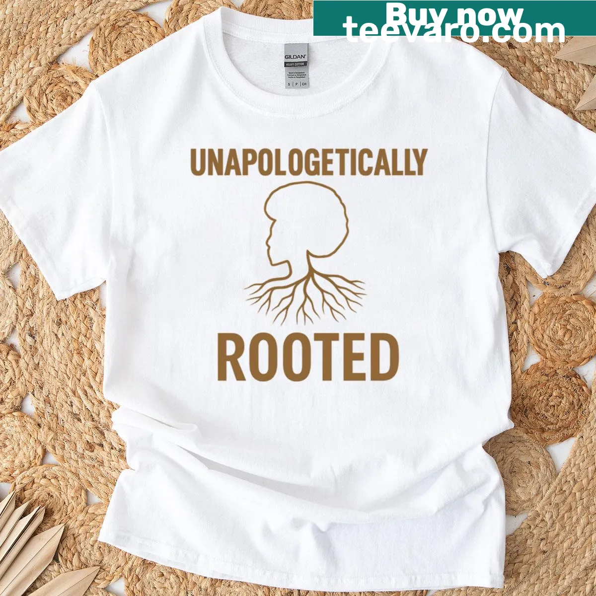 T-shirt with the phrase 'Unapologetically Rooted' in bold typography — on a men's t-shirt