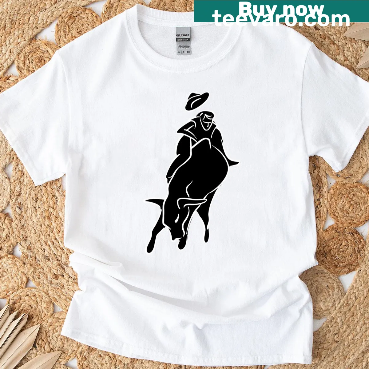 Graphic T-shirt featuring a bull rider holding on tightly. — on a men's t-shirt