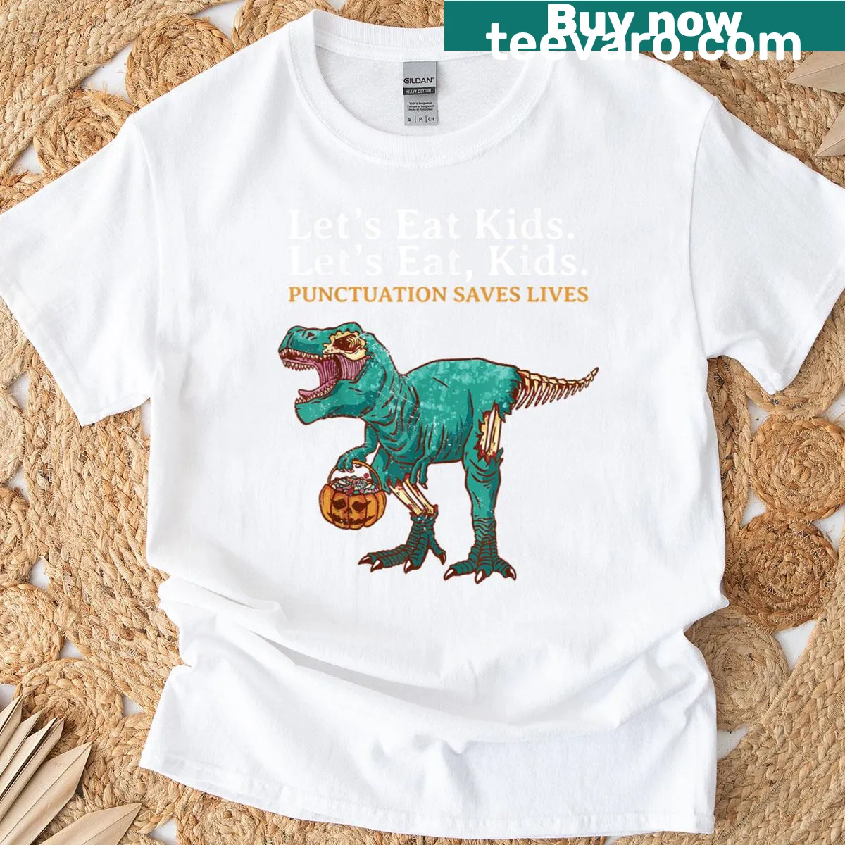 Cartoon dinosaur graphic with humorous text for Halloween — on a men's t-shirt