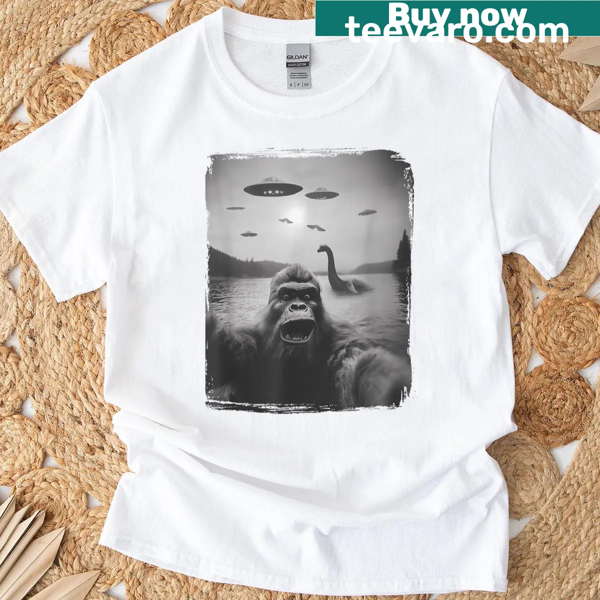 Illustration of Nessie and Sasquatch taking a selfie with a UFO. — on a men's t-shirt