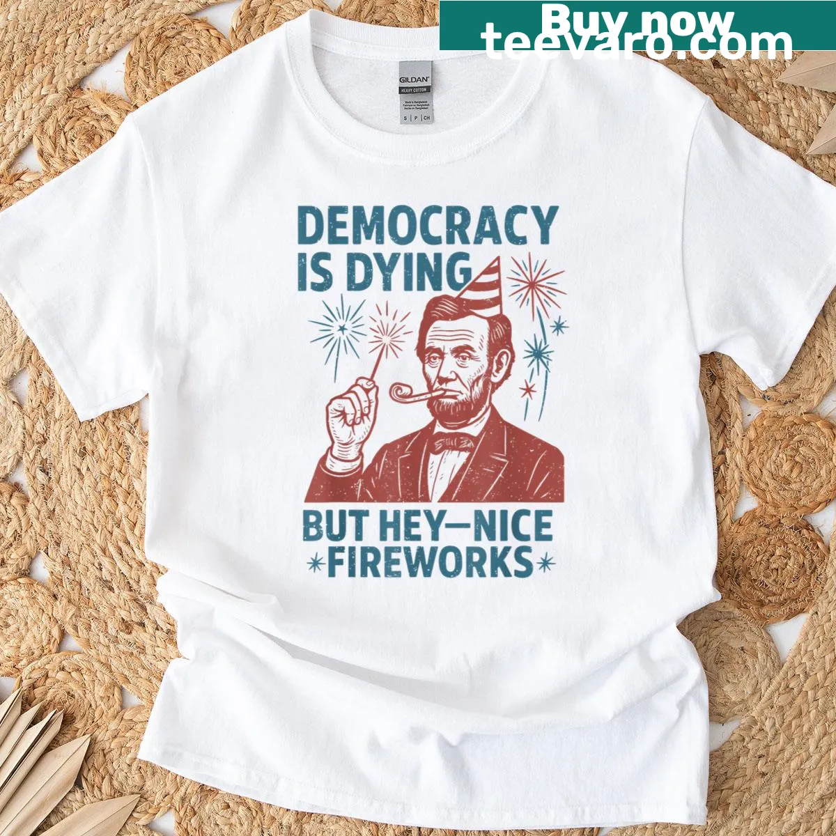 Illustrative T-shirt featuring fireworks and Abe Lincoln with text — on a men's t-shirt