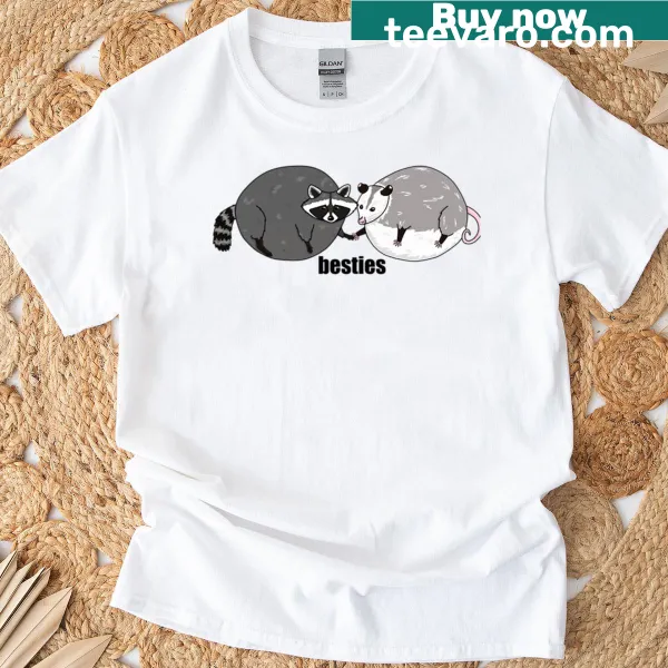 Cartoon graphic of a raccoon and opossum together on a T-shirt