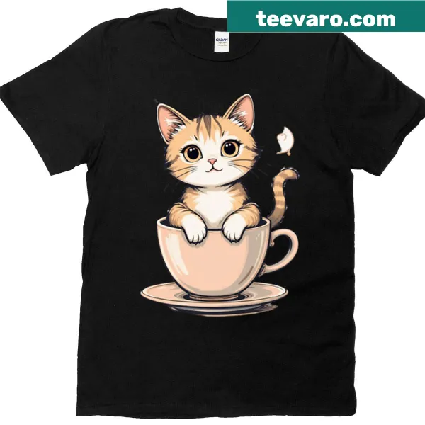 Cartoon cat design next to a cup of coffee on an oversized tee