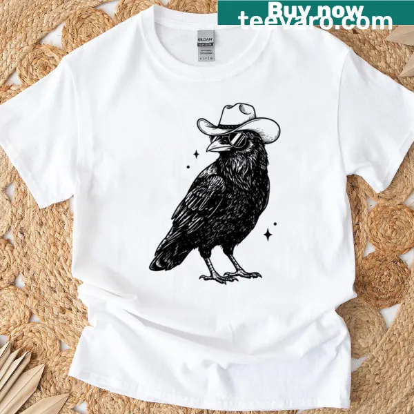 Cartoon graphic of a cowboy raven with hat and sunglasses on an oversized T-shirt
