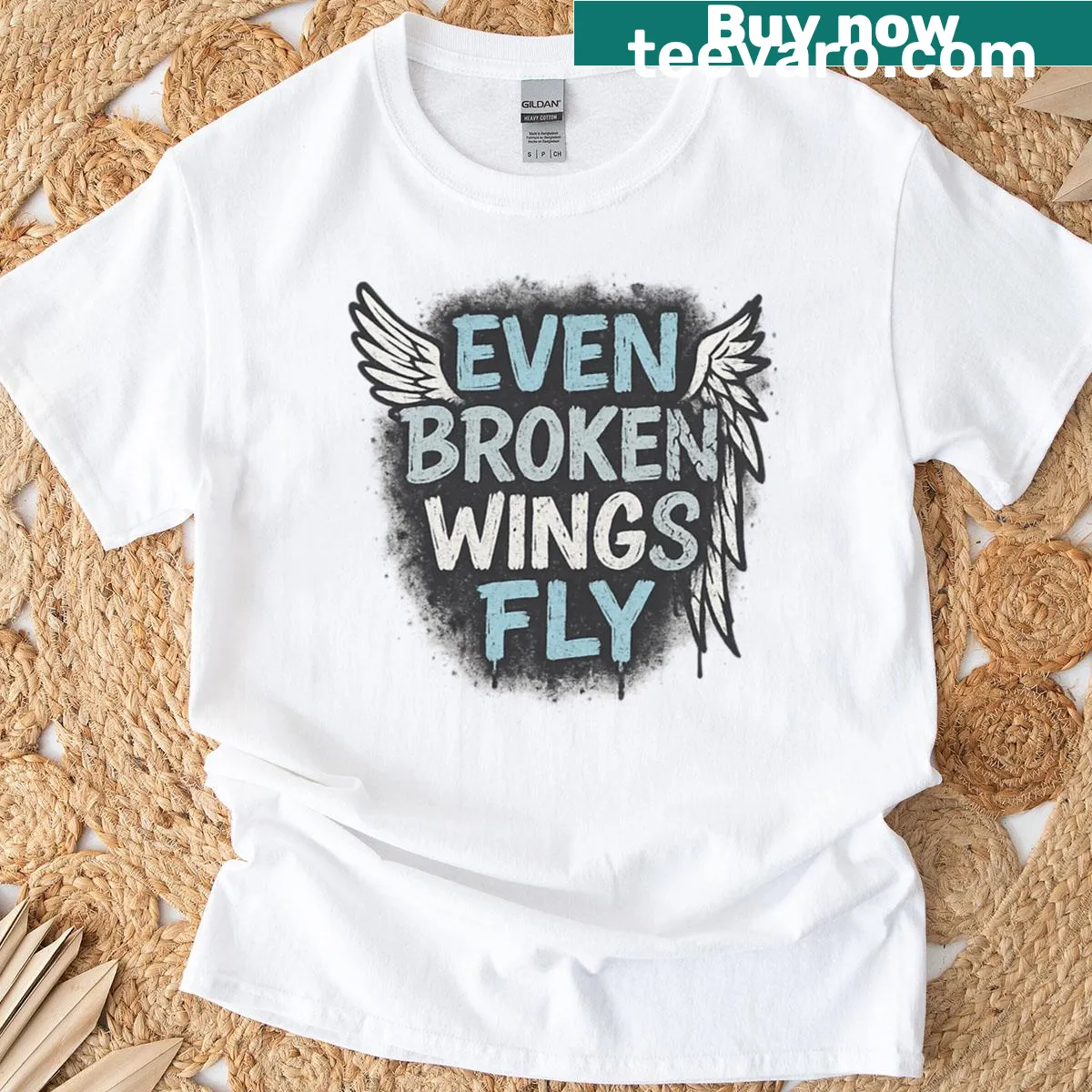 T-shirt with the inspiring phrase 'Even Broken Wings Fly' in an urban design. — on a men's t-shirt