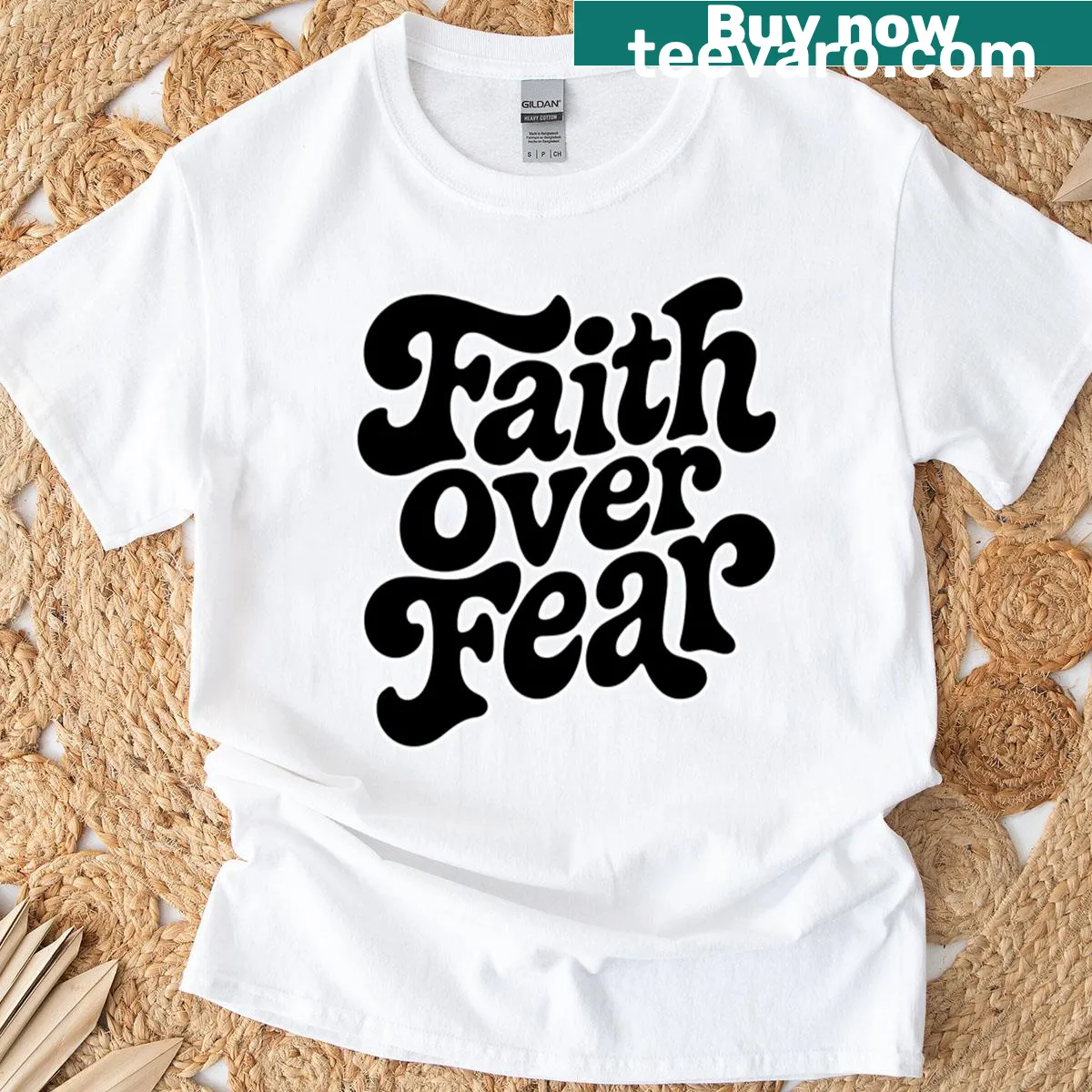 Inspirational text 'Faith Over Fear' on T-shirt — on a men's t-shirt