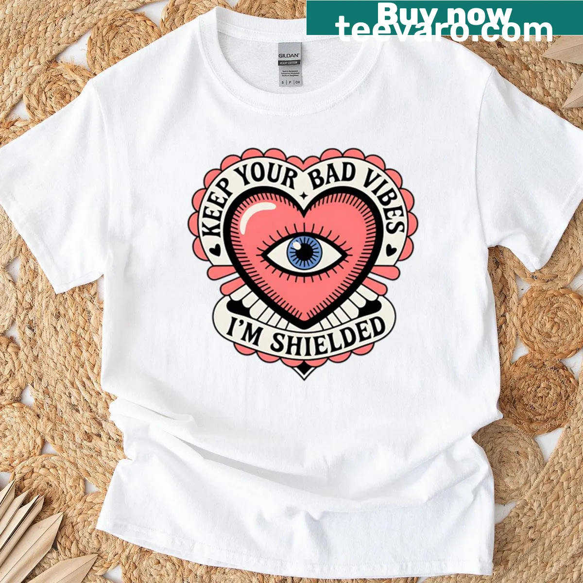 Tattoo-style T-shirt with heart and eye design guarding against bad vibes. — on a men's t-shirt
