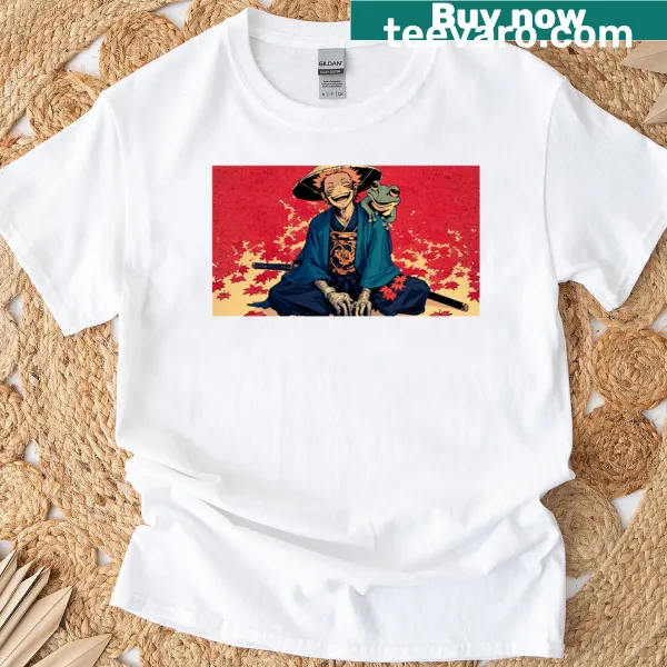 Whimsical samurai and frog design amidst autumn leaves on a T-shirt