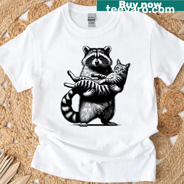 Adopt Don't Shop T-shirt featuring a cute raccoon and cat duo.