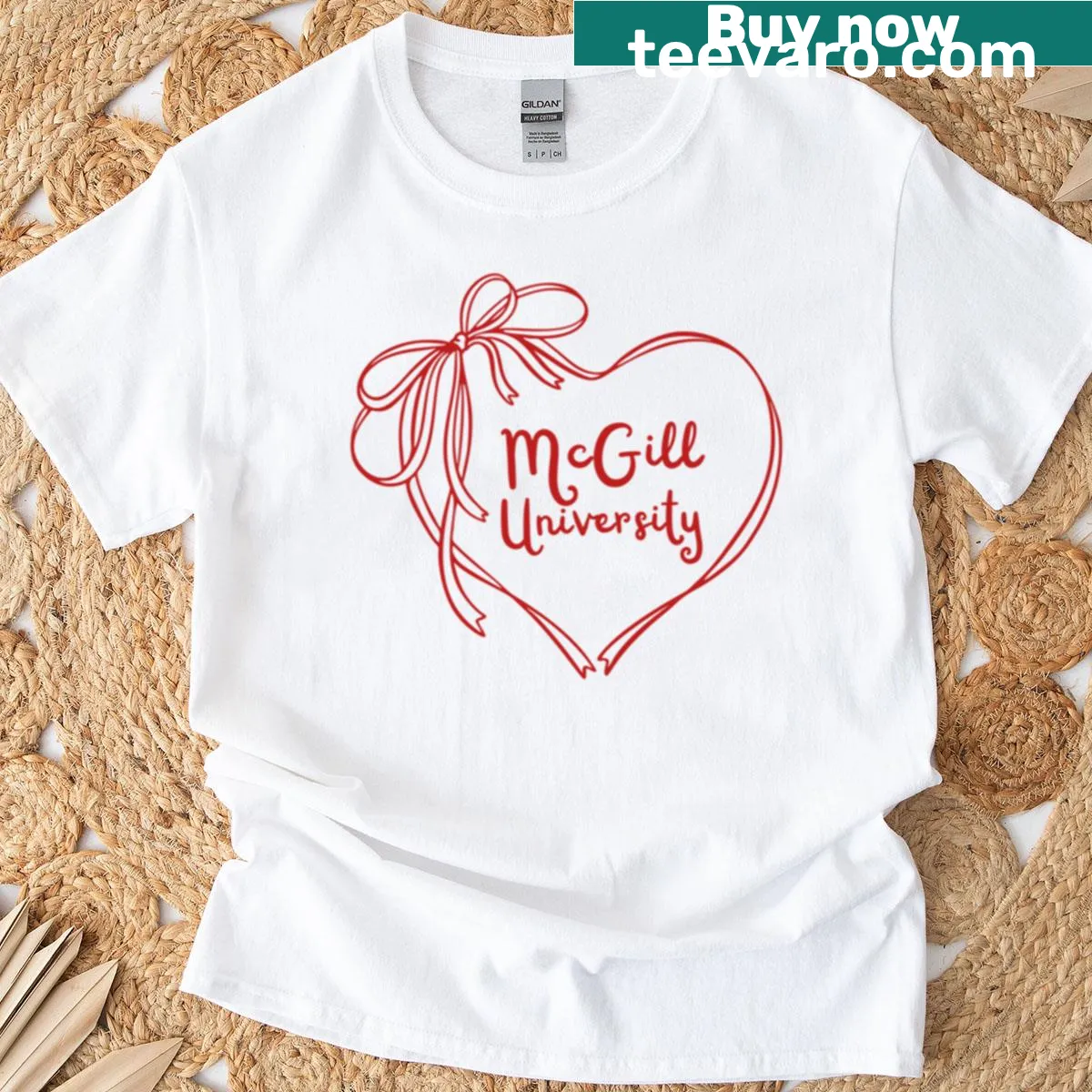 Trendy oversized T-shirt featuring McGill University inspired bow and heart design. — on a men's t-shirt