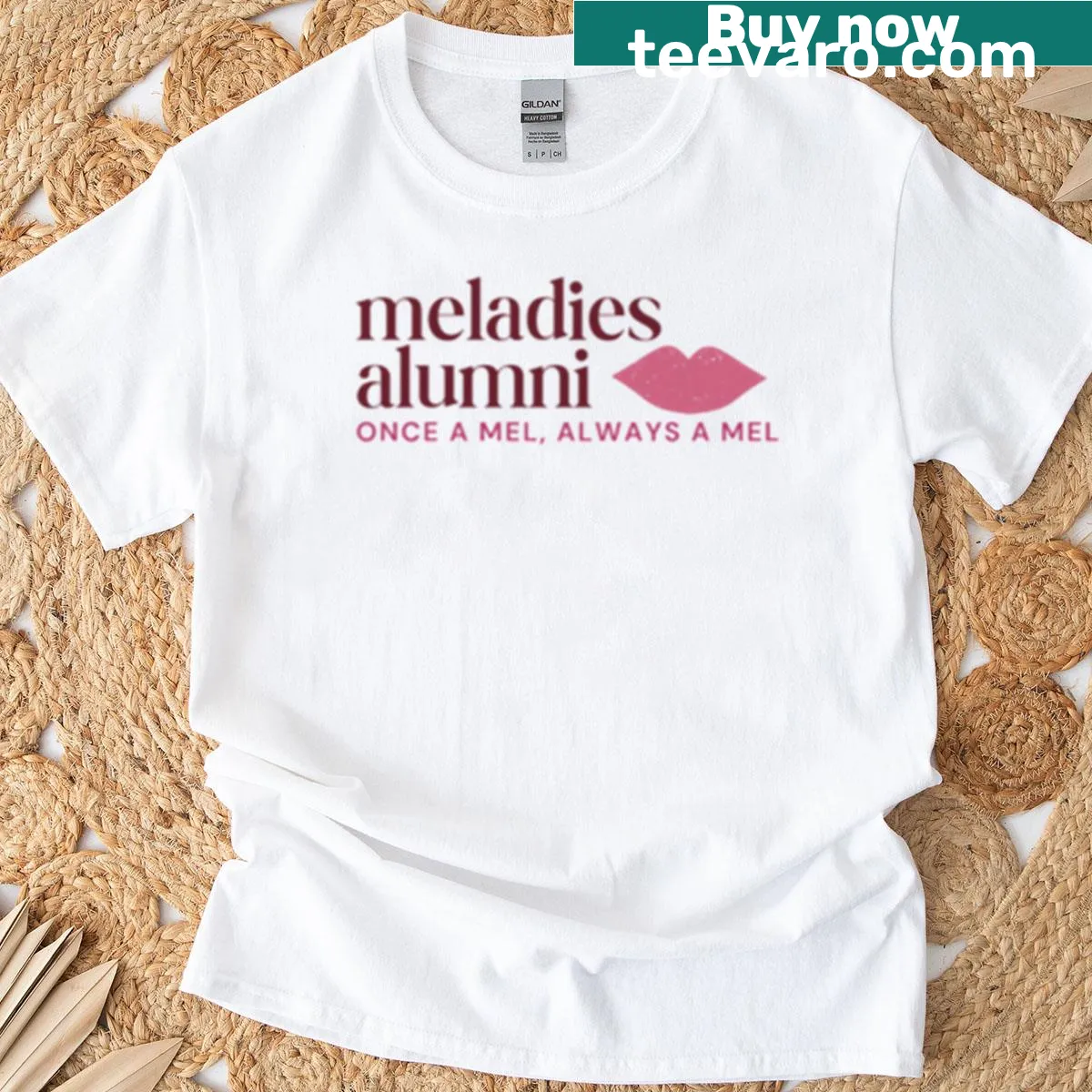 Meladies alumni horizontal logo t-shirt with school branding — on a men's t-shirt