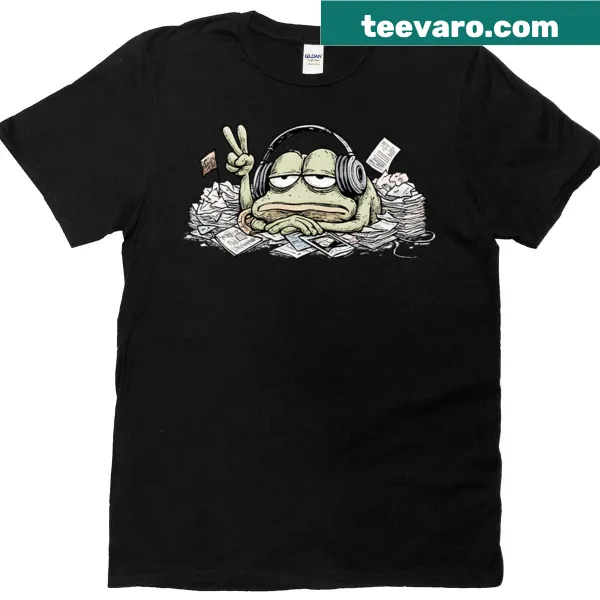 Cartoon t-shirt featuring a tired frog in headphones surrounded by papers
