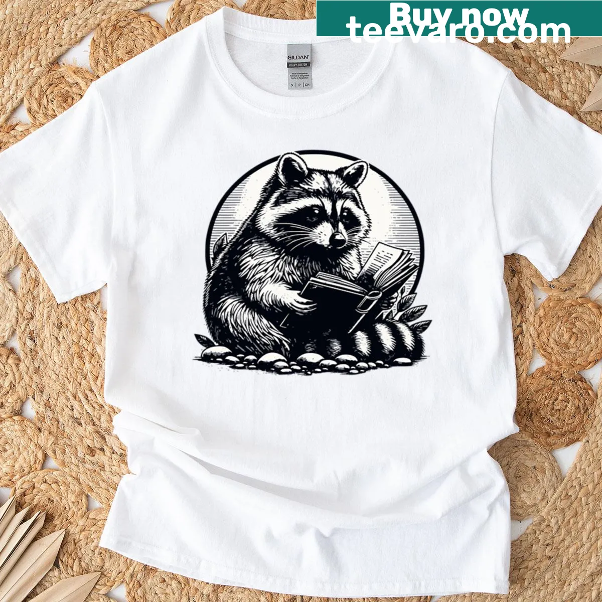 Cartoon raccoon t-shirt for book lovers featuring a reading theme — on a men's t-shirt