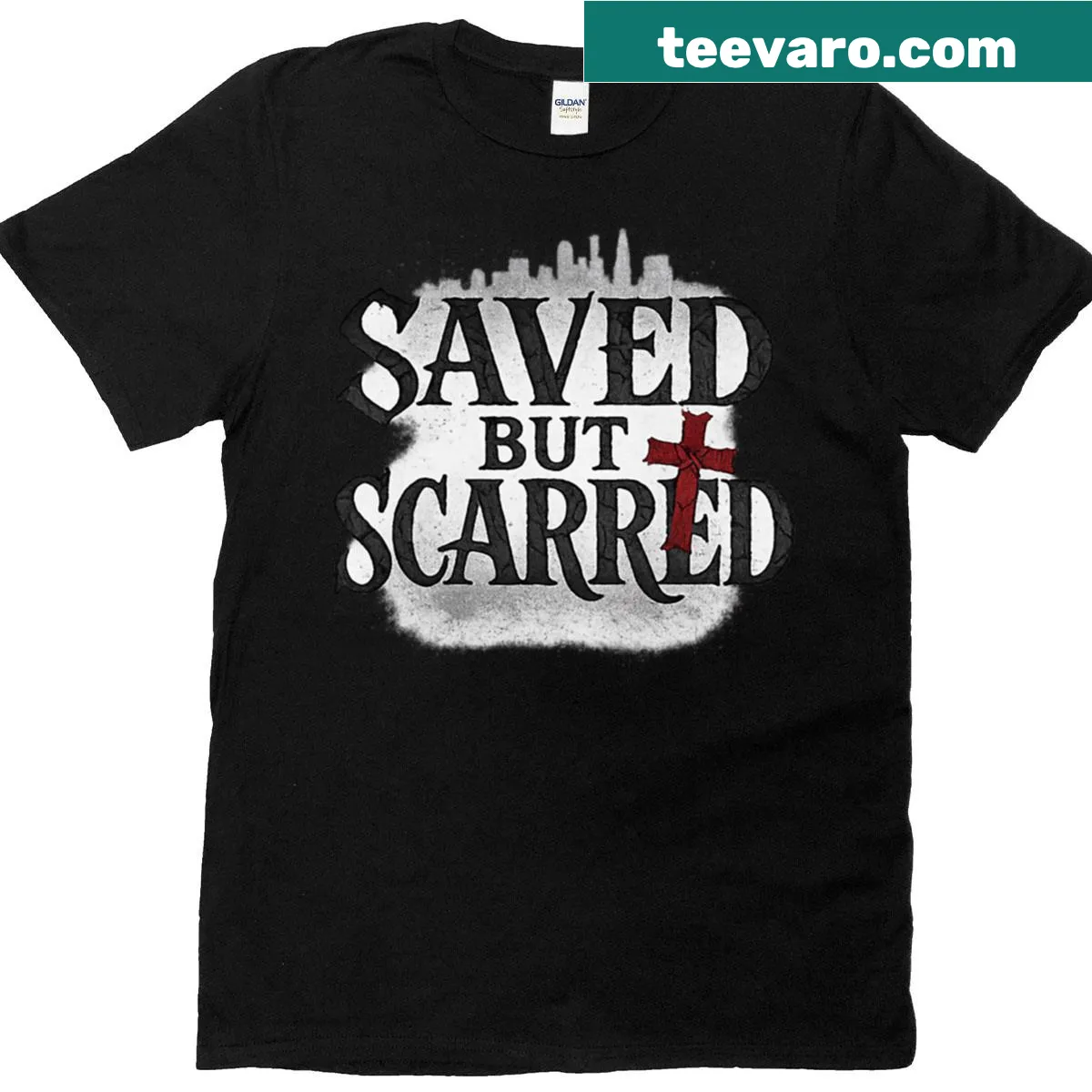 Graffiti-style streetwear t-shirt with 'Saved But Scarred' text — on a men's t-shirt
