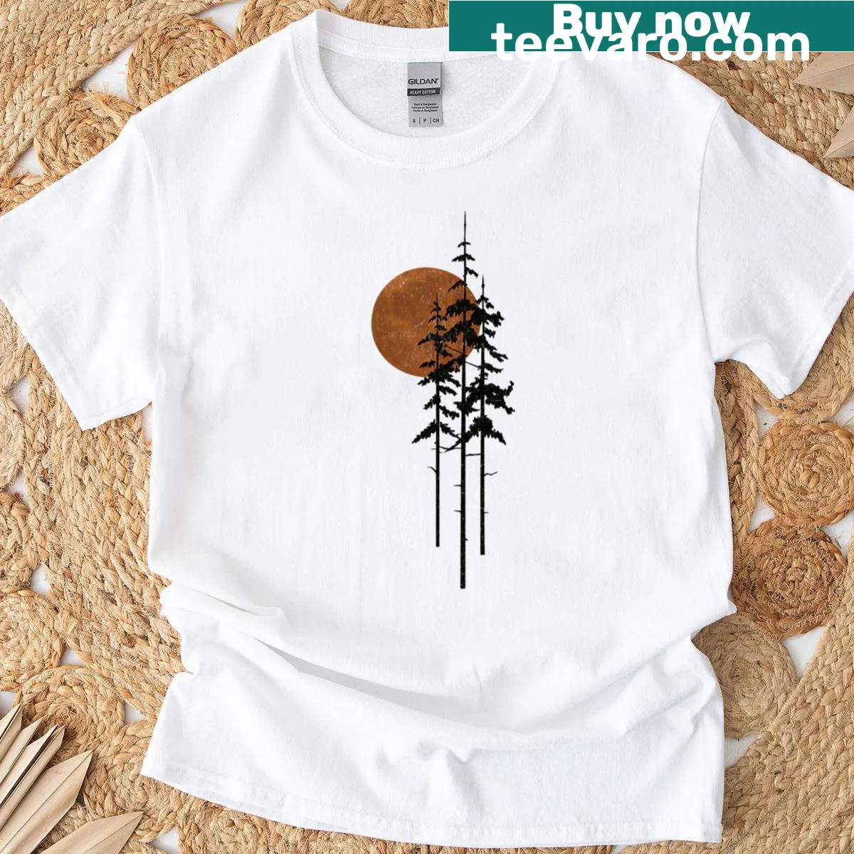 Minimalist T-shirt with a forest sunrise design — on a men's t-shirt