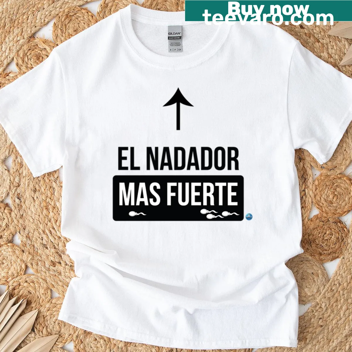 Bold text 'The Strongest Swimmer' in Spanish on oversized T-shirt — on a men's t-shirt