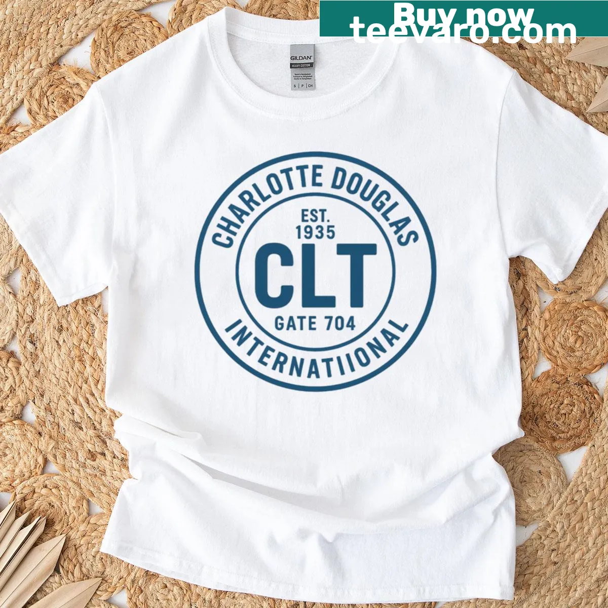 Badge design t-shirt representing Charlotte Douglas International Airport. — on a men's t-shirt