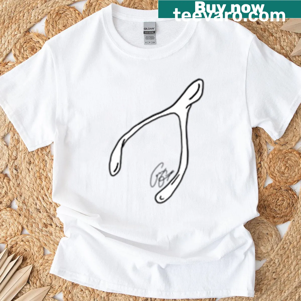 Whimsical wishbone sticker graphic on a playful t-shirt — on a men's t-shirt