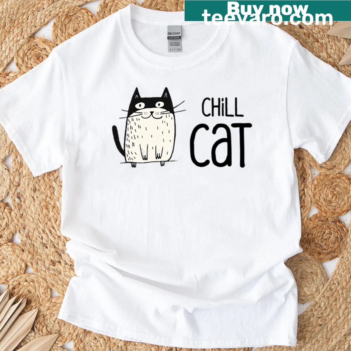 Minimalist black and white cartoon cat graphic — on a men's t-shirt