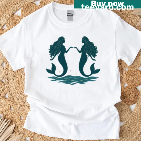 Illustration of elegant mermaids with flowing hair in water on T-shirt.