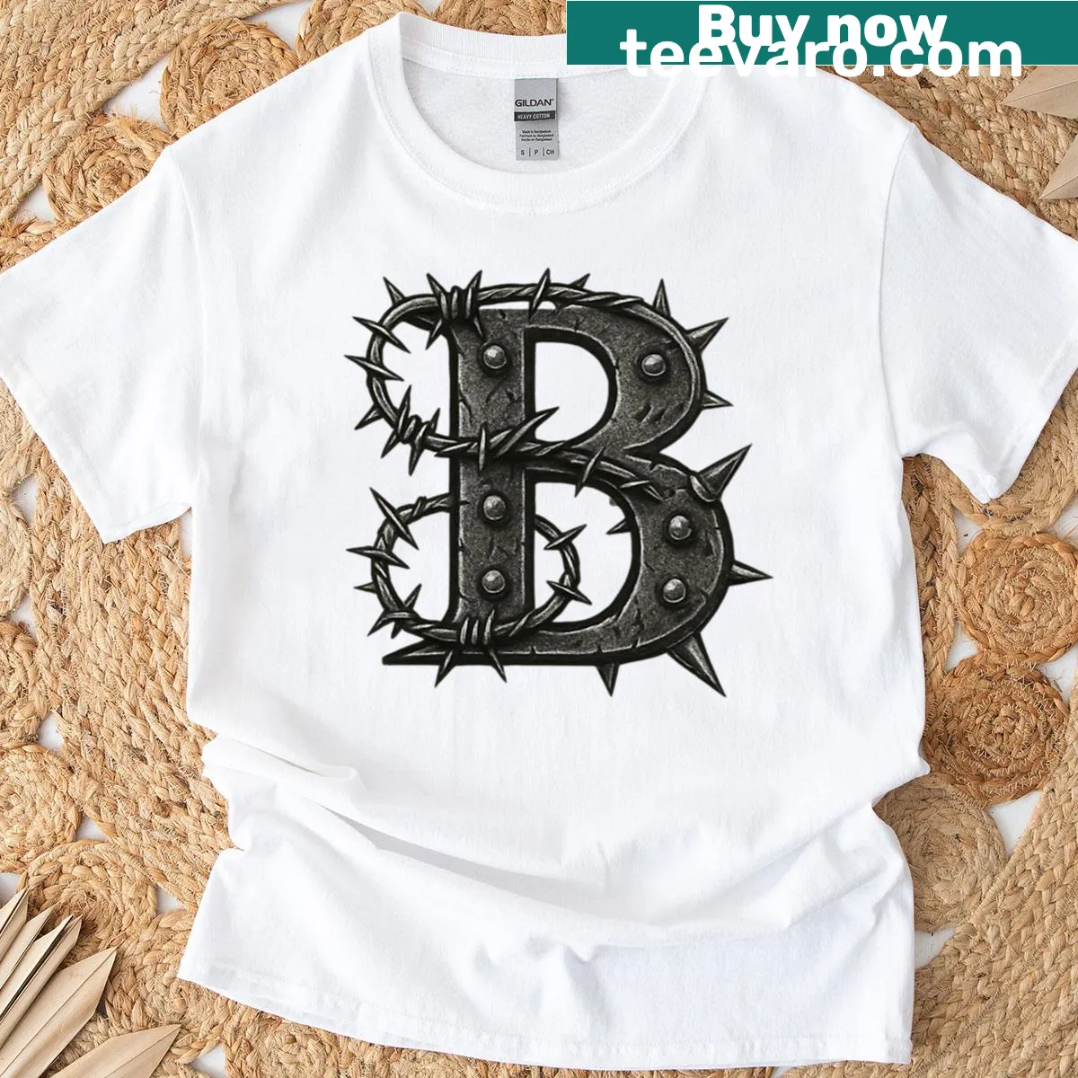 Gothic 'B' letter T-shirt featuring spiked font and barbed wire — on a men's t-shirt