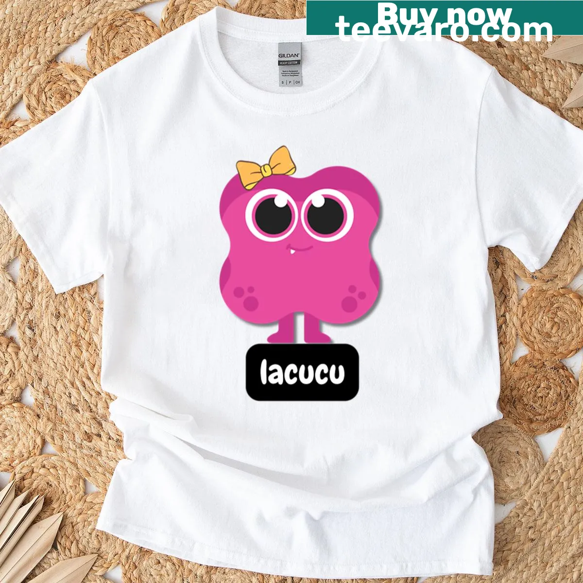 Cute pink monster character with a bow on a t-shirt — on a men's t-shirt