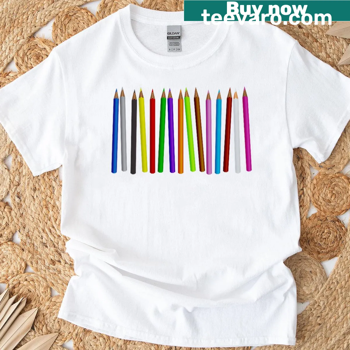 Illustrated T-shirt featuring colored pencils and a coloring book — on a men's t-shirt