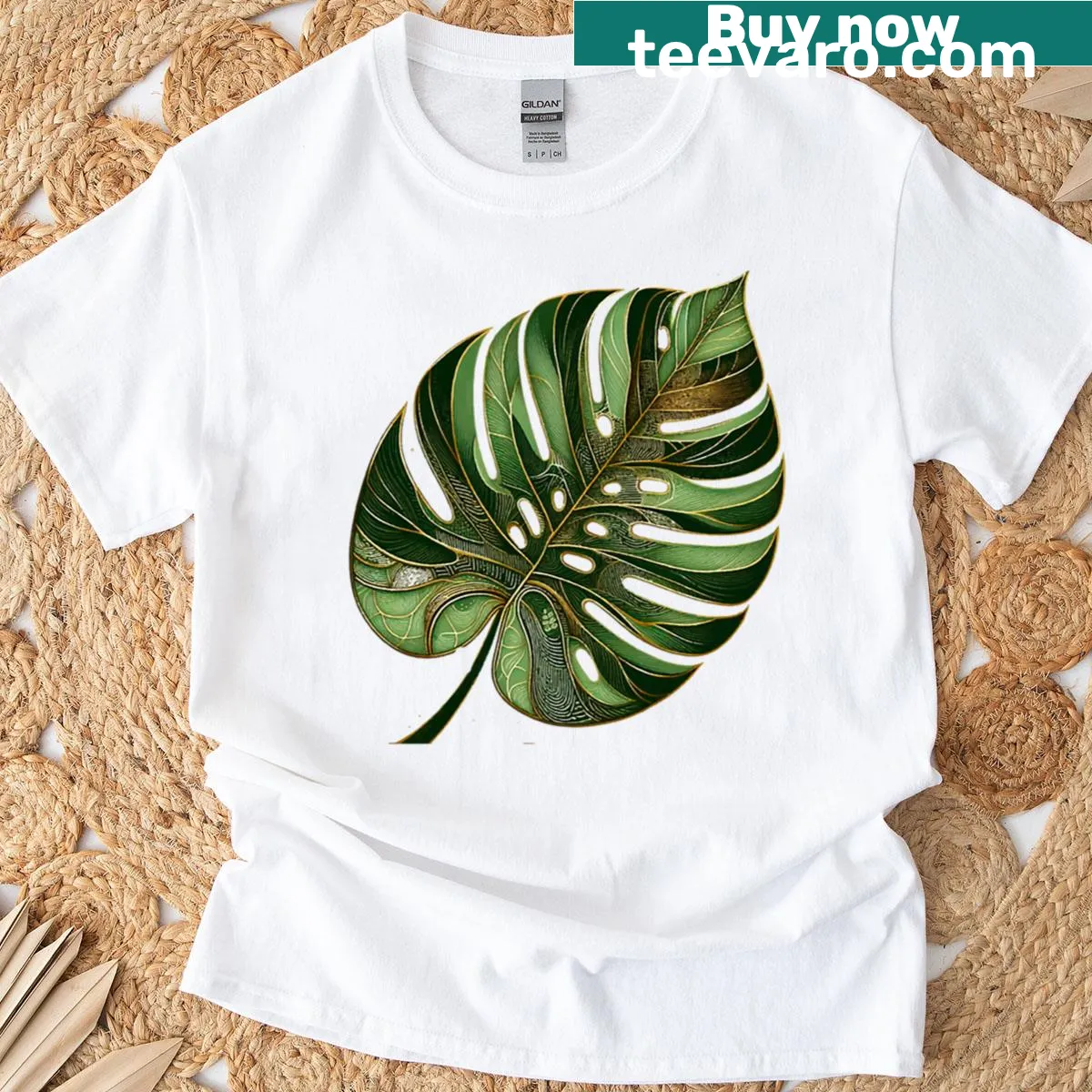 Minimalist monstera leaf illustration in green and gold on a t-shirt — on a men's t-shirt