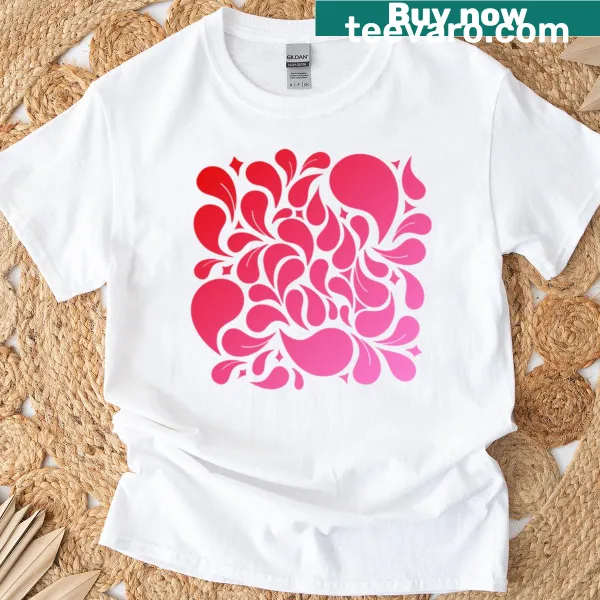 T-shirt featuring a playful red and pink drop pattern design