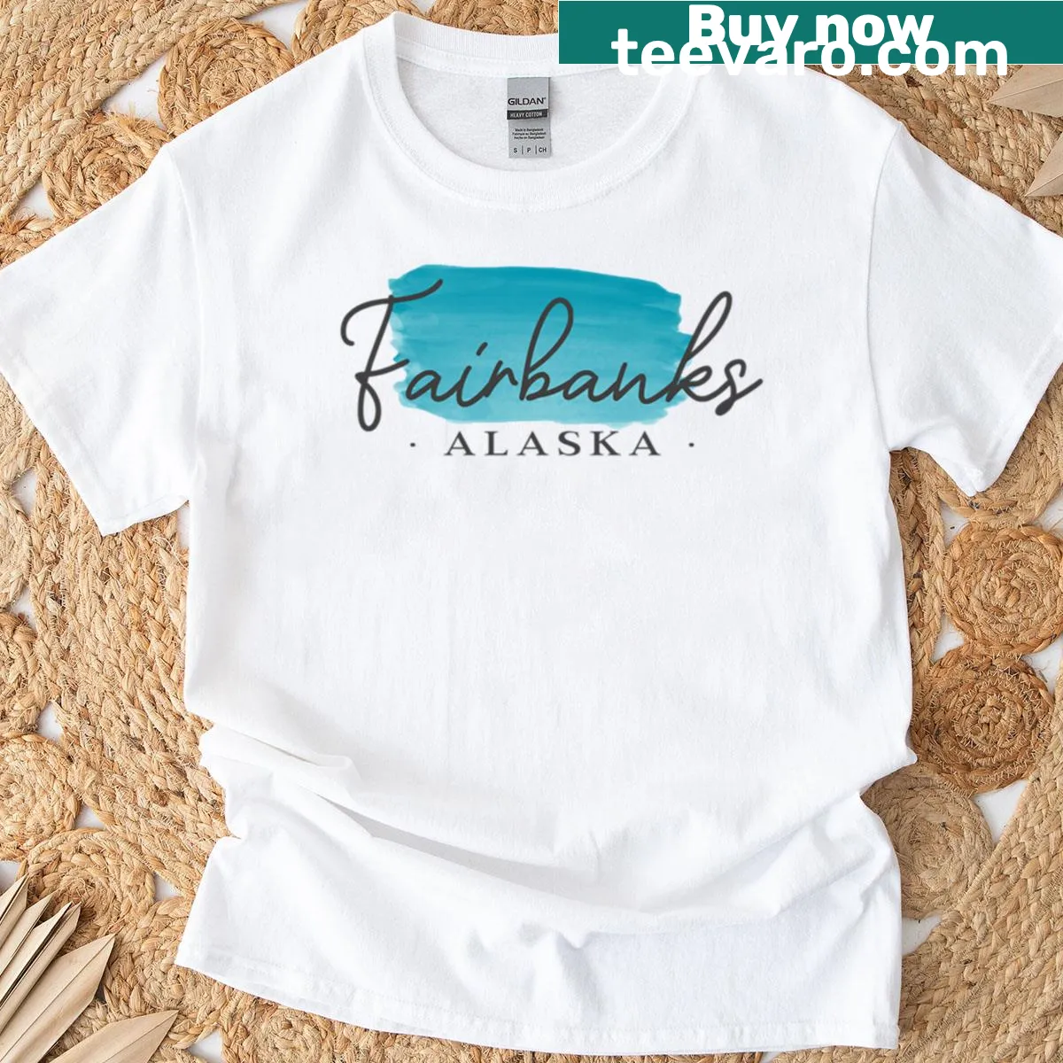 Illustrated Alaska landscape graphic T-shirt — on a men's t-shirt