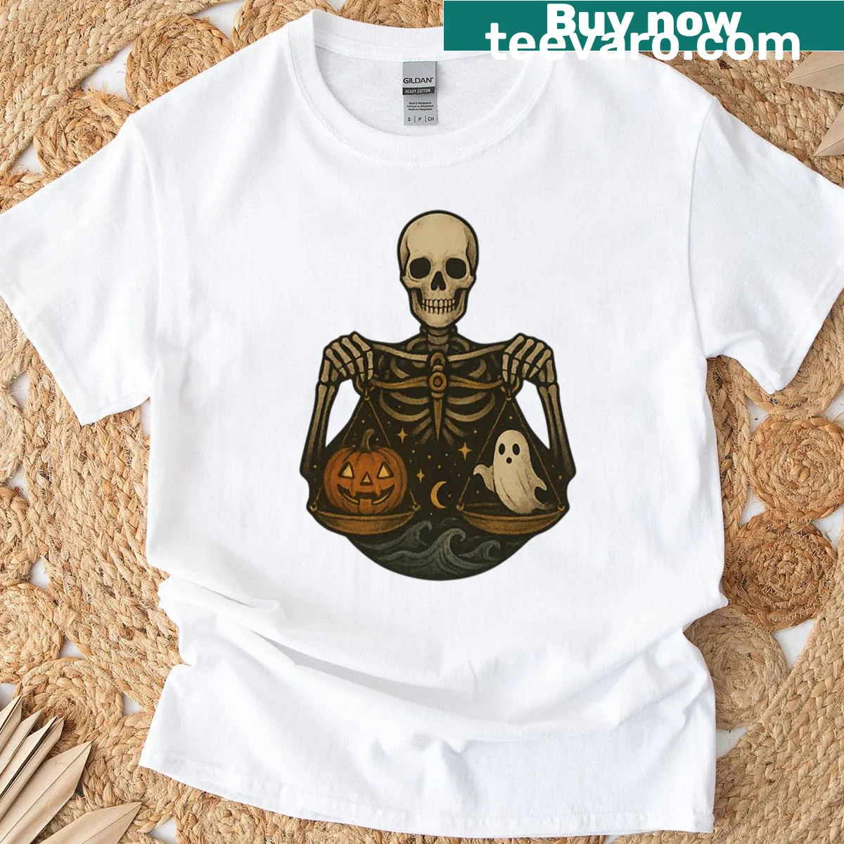 Skeleton Libra graphic t-shirt with balance scales for Halloween — on a men's t-shirt