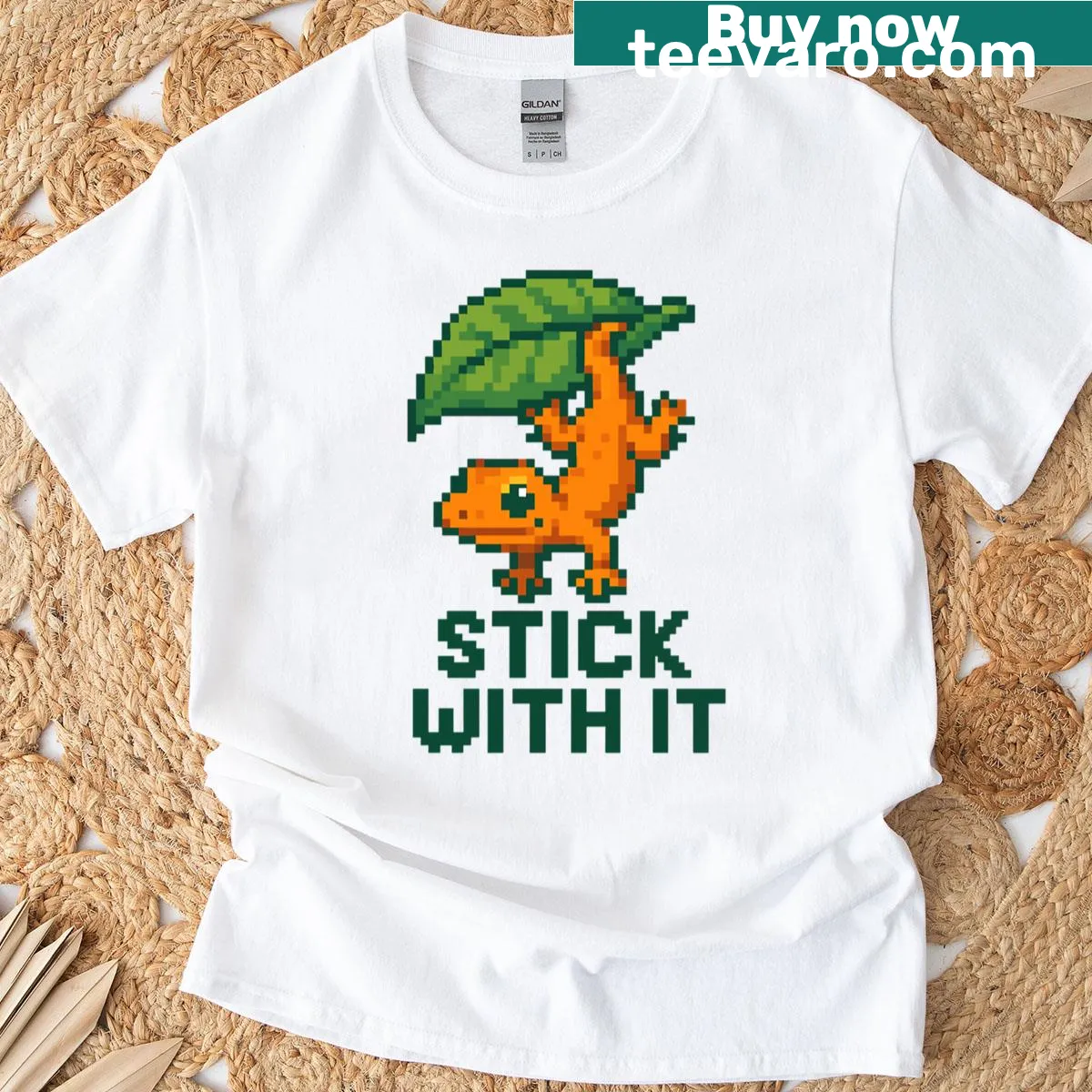 Cartoon gecko on leaf graphic t-shirt with playful design — on a men's t-shirt