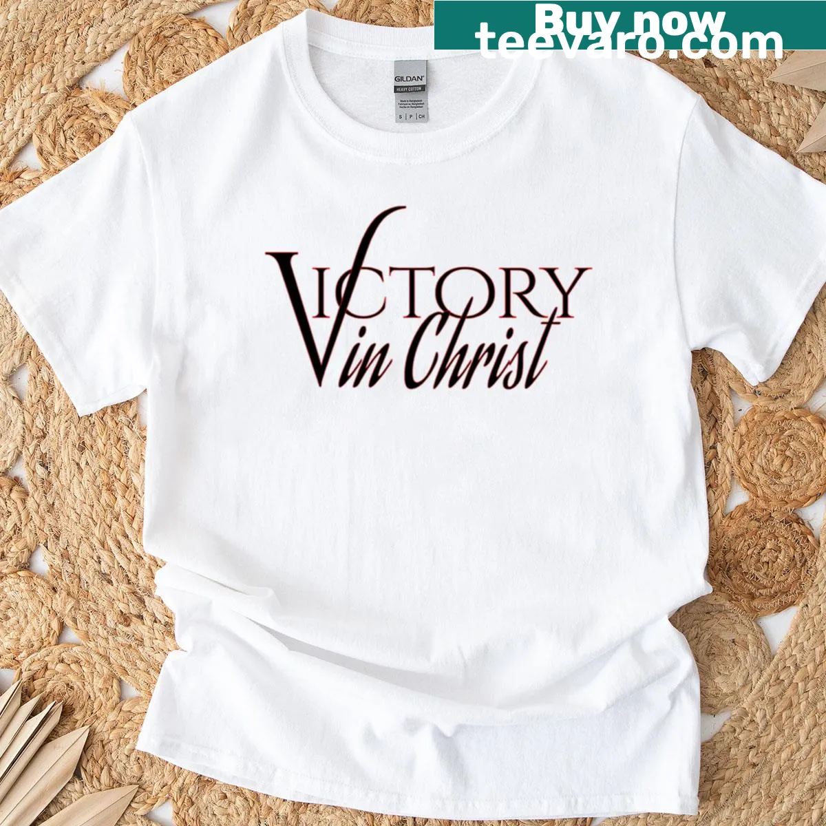 Victory In Christ T-shirt with black background and red border — on a men's t-shirt
