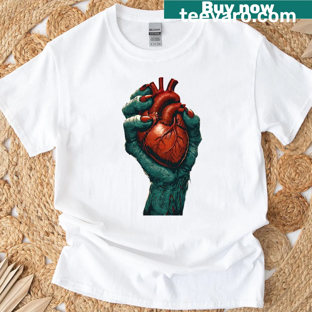 Cartoon T-shirt featuring a zombie hand holding a heart for Halloween — on a men's t-shirt