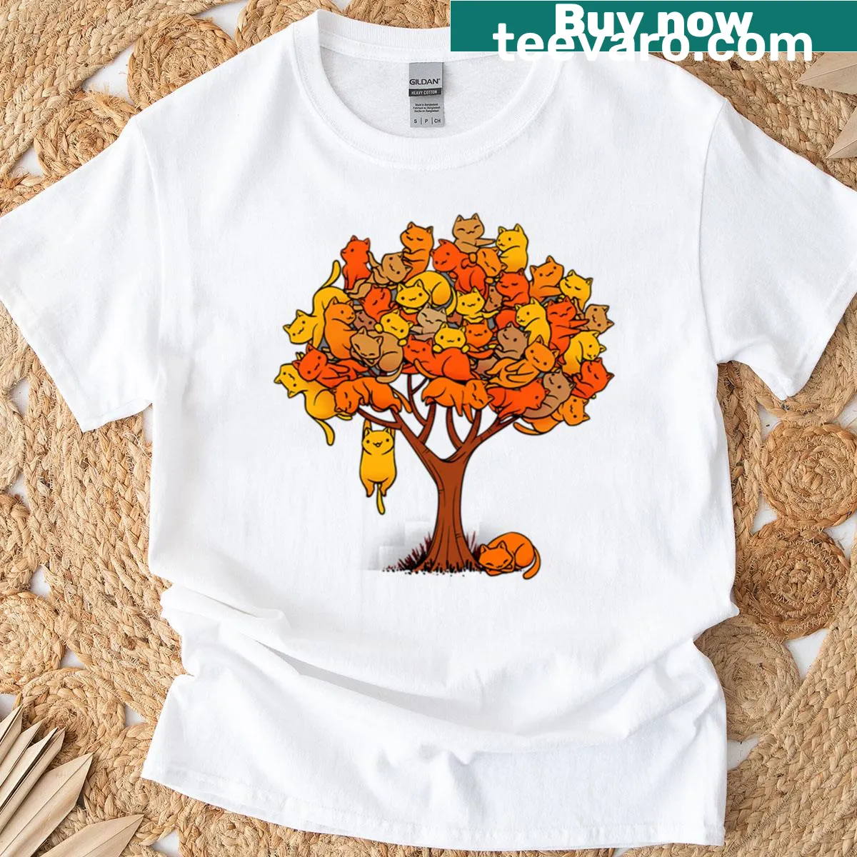 T-shirt featuring an illustration of a cat on a whimsical tree — on a men's t-shirt