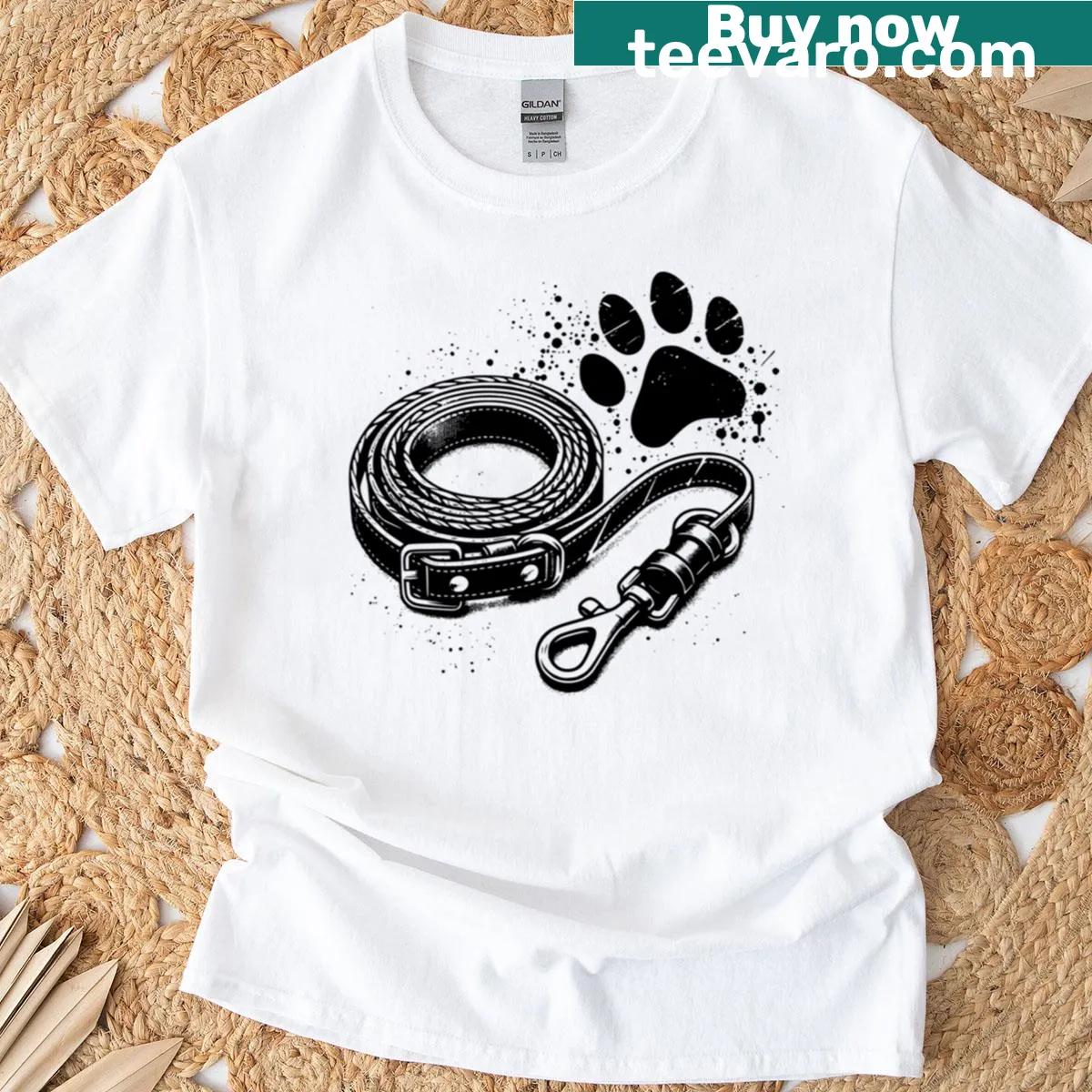 Cartoon graphic T-shirt with dog leash and paw print design — on a men's t-shirt