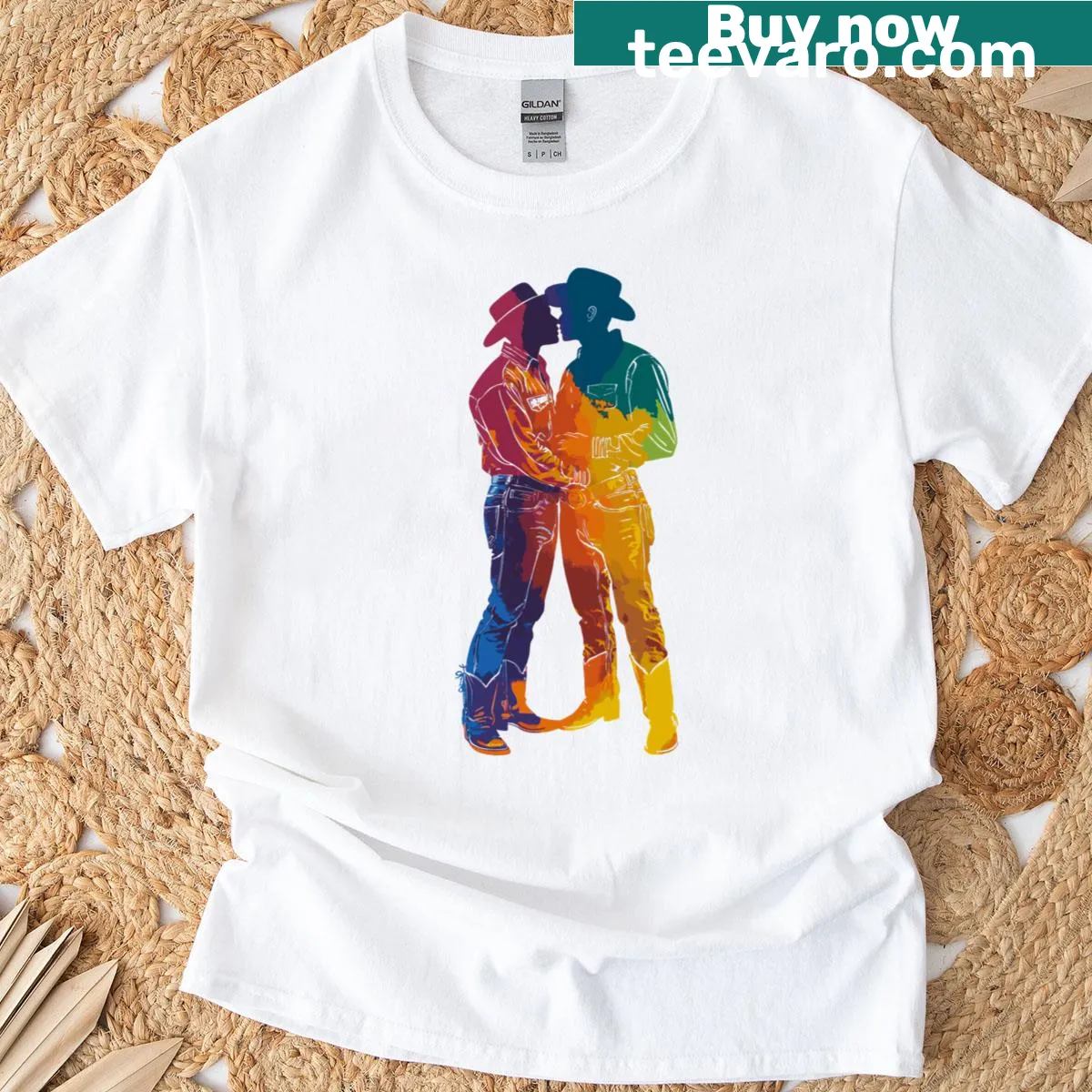 T-shirt featuring kissing cowboys and rainbow pride design — on a men's t-shirt