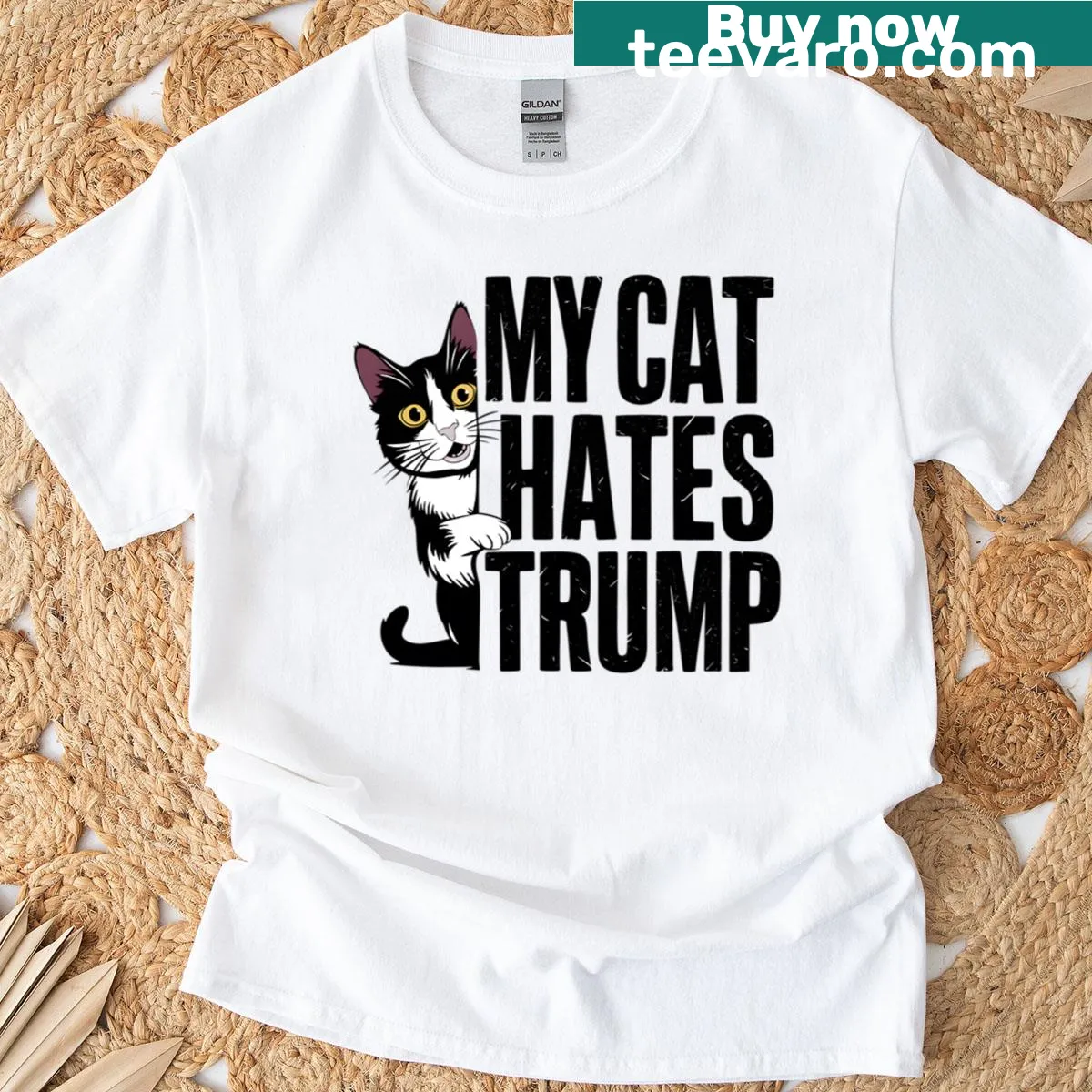 Illustrative black and white cat design on My Cat Hates Trump shirt with bold humor. — on a men's t-shirt