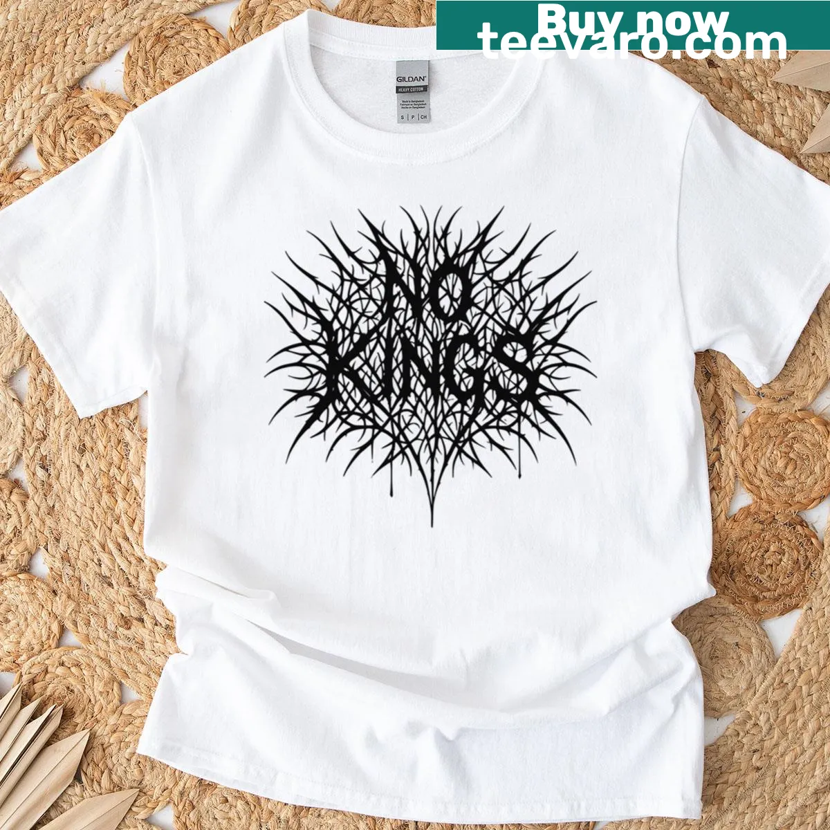 Edgy black-metal protest logo on No Kings Spiky t-shirt reflecting rebellious spirit. — on a men's t-shirt