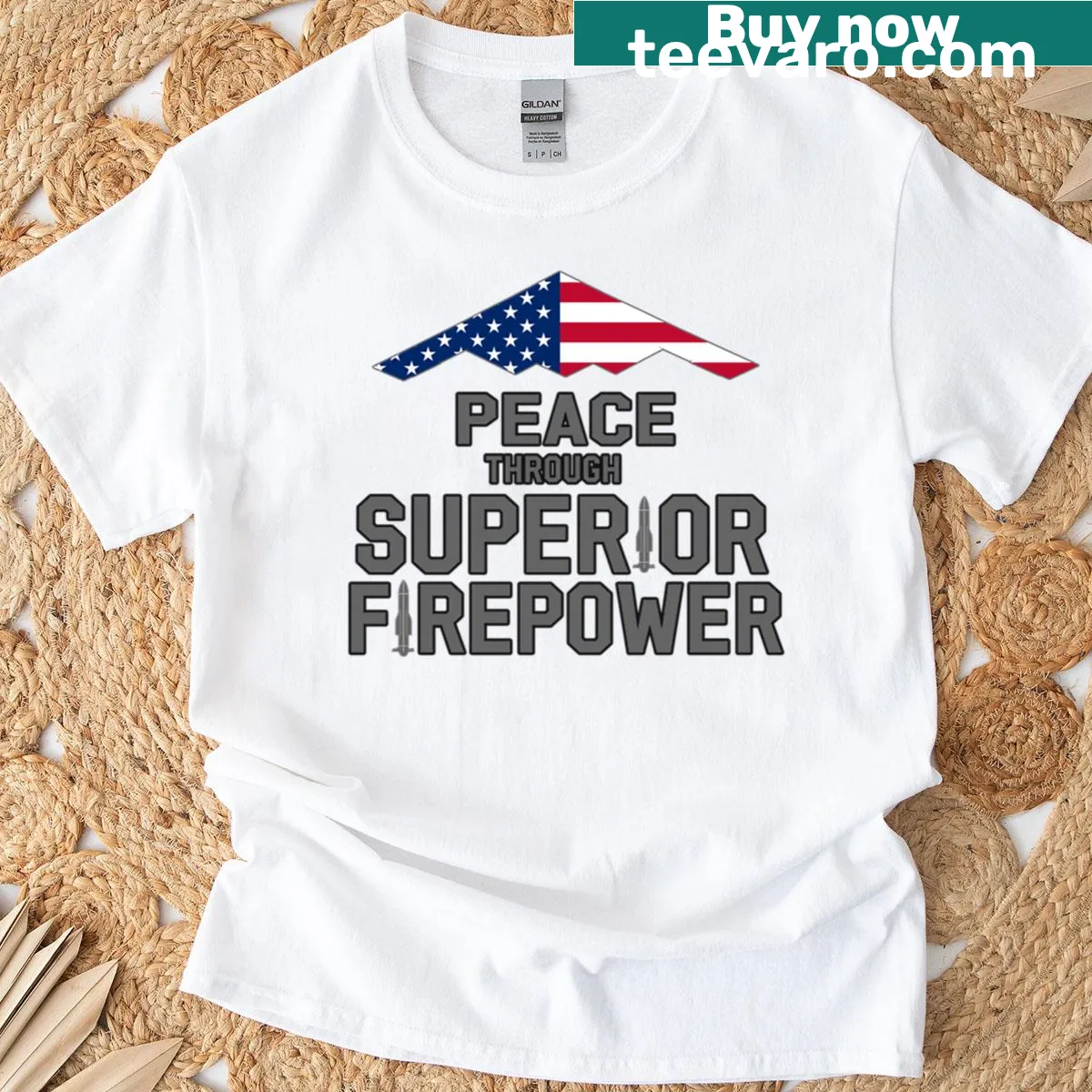 Graphic t-shirt with B-2 Spirit bomber and 'Peace Through Superior Firepower' text. — on a men's t-shirt