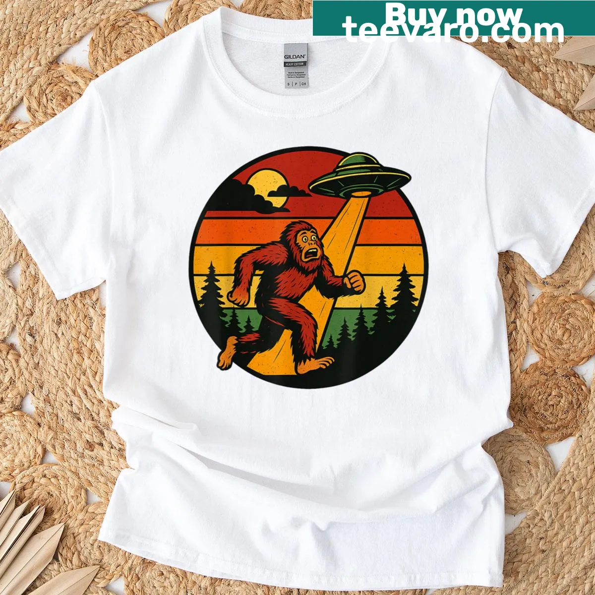 Humorous T-shirt featuring Bigfoot running from a UFO — on a men's t-shirt