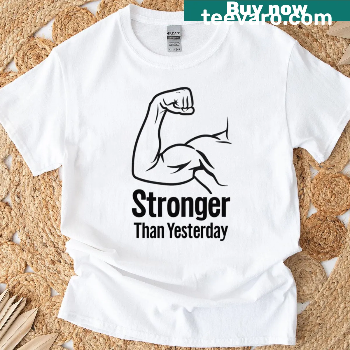 Graphic of a raised arm with text 'Stronger Than Yesterday' on a T-shirt. — on a men's t-shirt