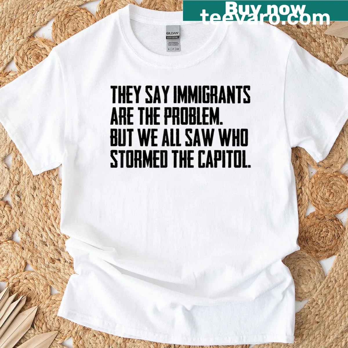 Edgy text graphic T-shirt addressing immigration issues — on a men's t-shirt